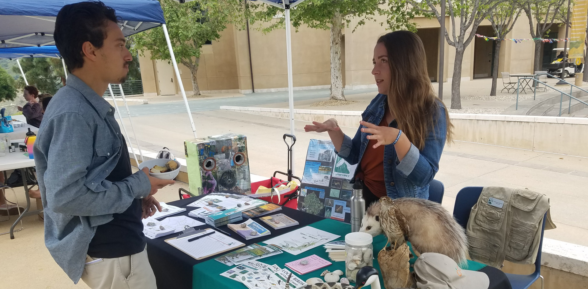 Students at a table at Eco Fair