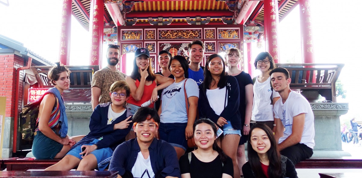 Group of students seated in front of building in Taipei