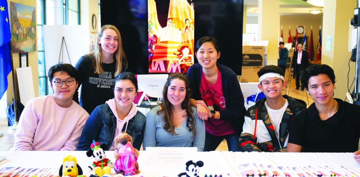 Image of students at a booth at the Learning Cluster fair.