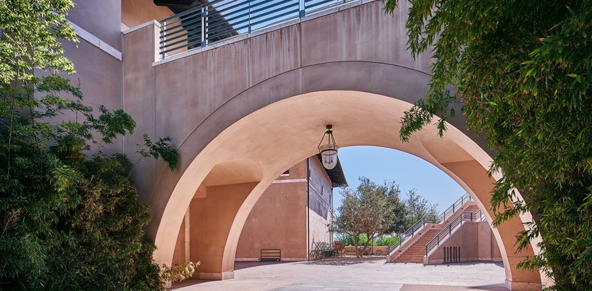 Archway under pedestrian bridge on campus