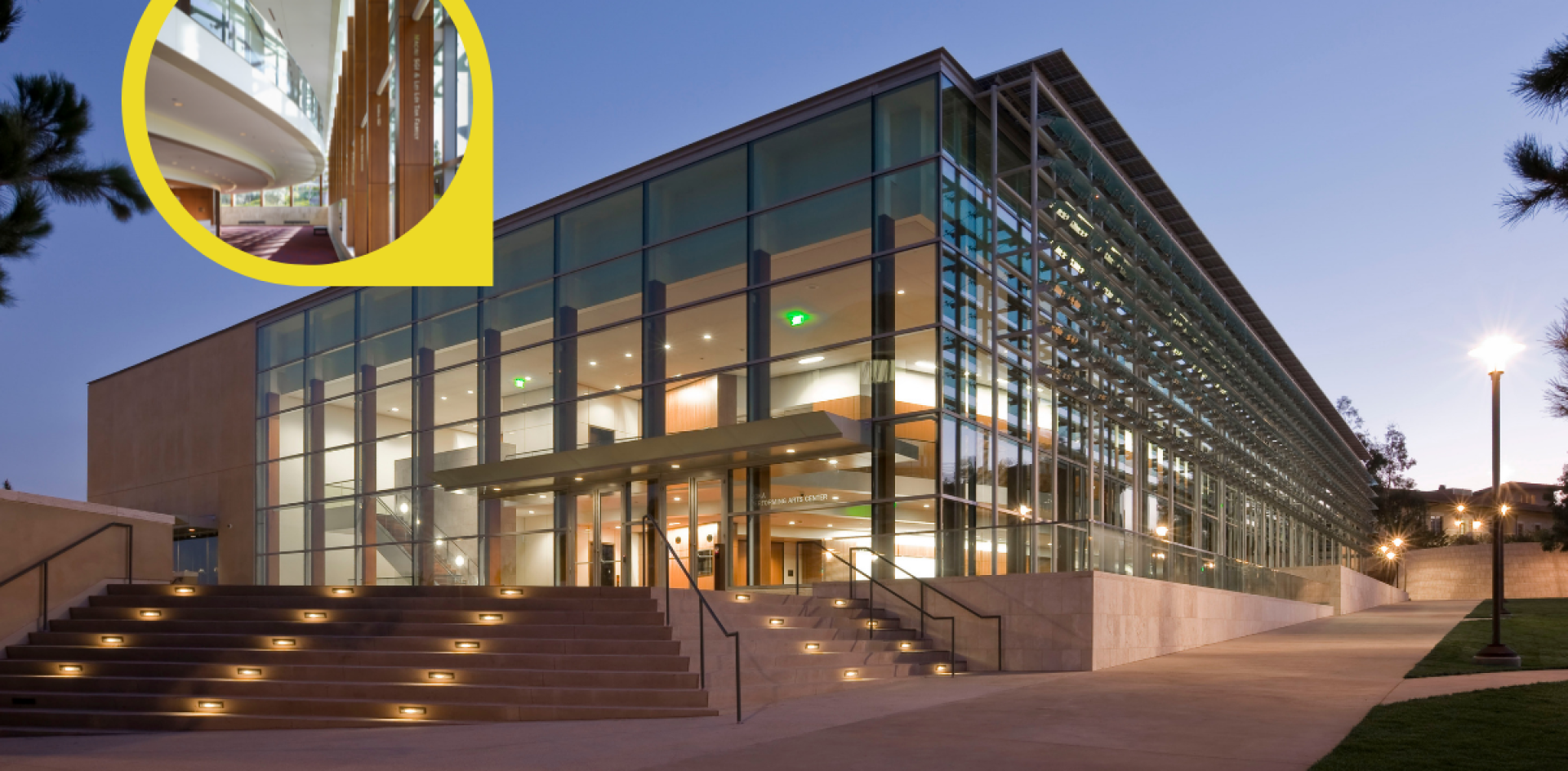 Exterior of Soka Performing Arts Center at night with inset of engraved pillars