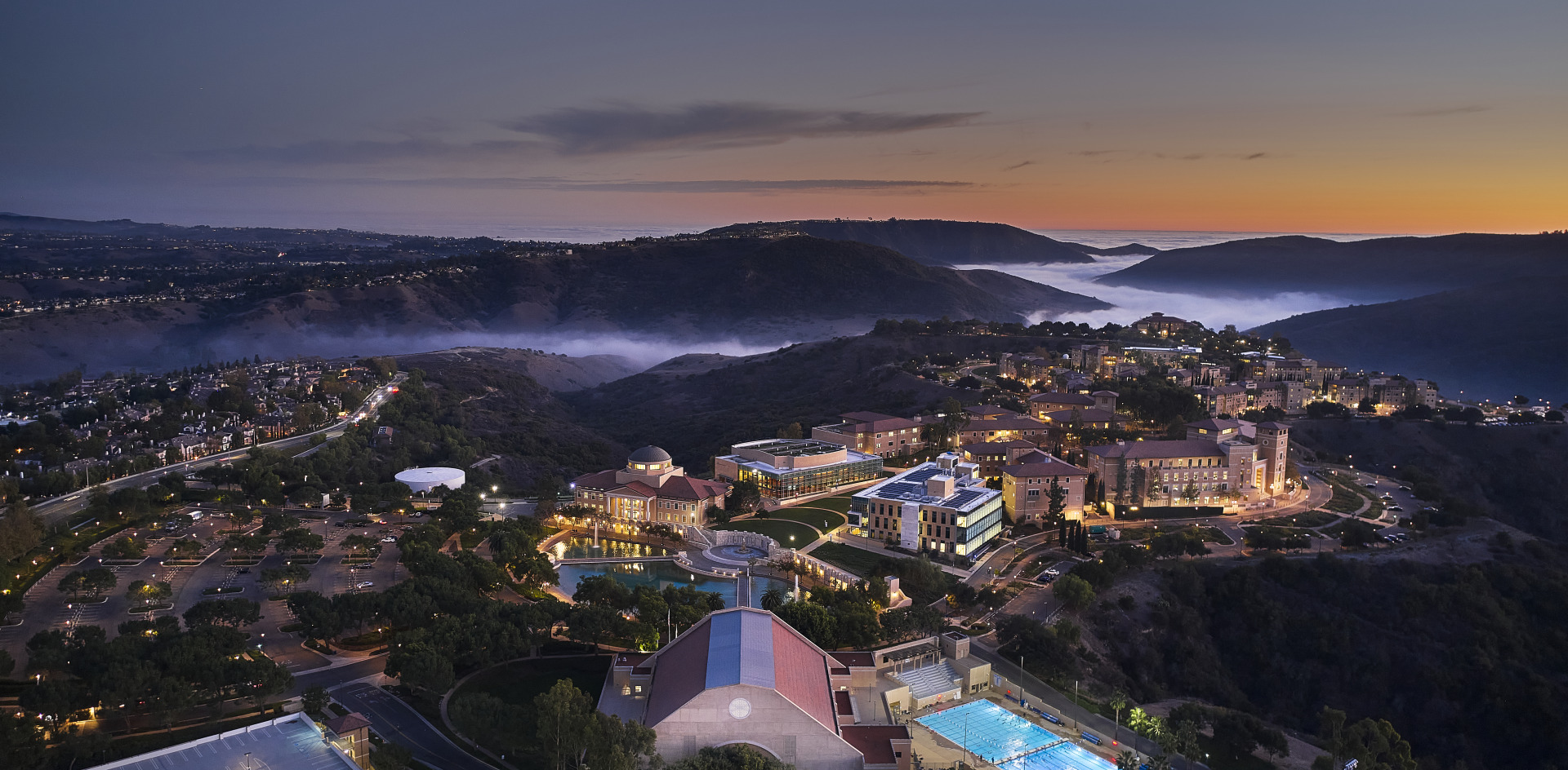 Aerial drone shot of SUA's campus during dusk