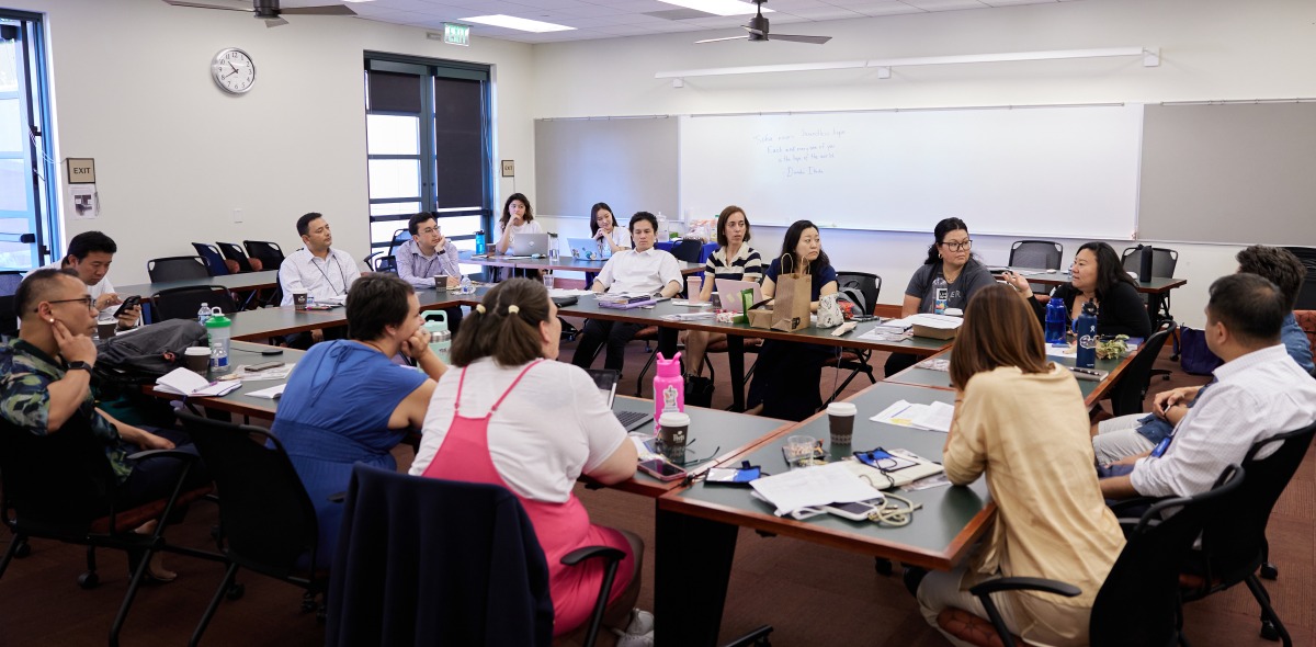 Attendees of the conference participate in a discussion