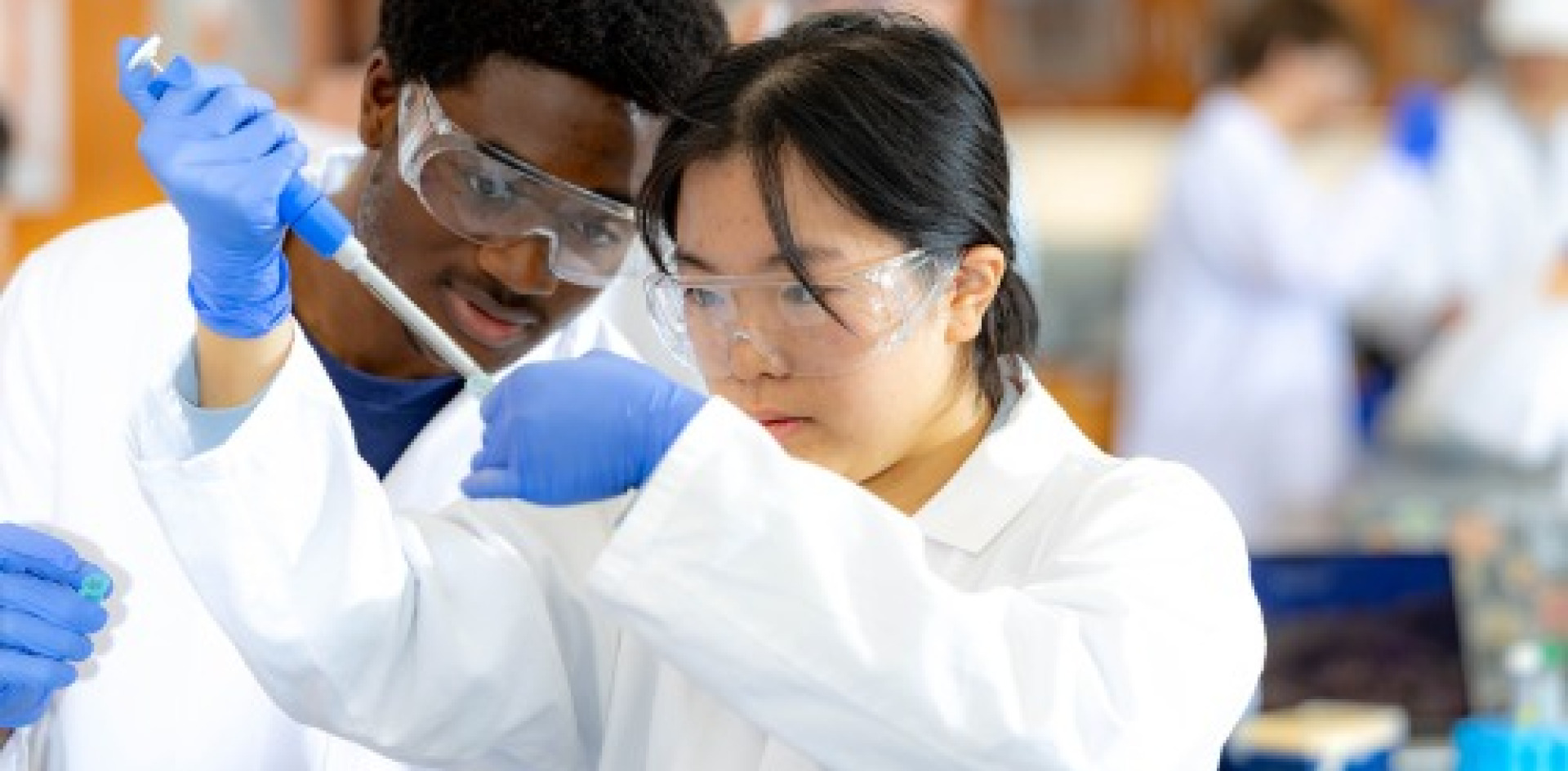 Two students working in a lab