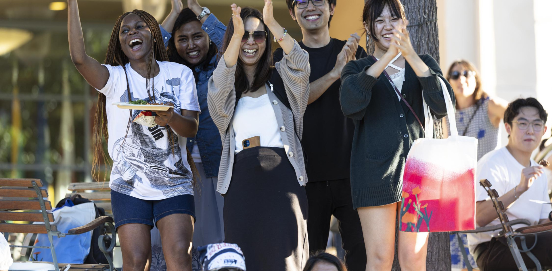 Students applaud during a welcome back event on SUA's campus.
