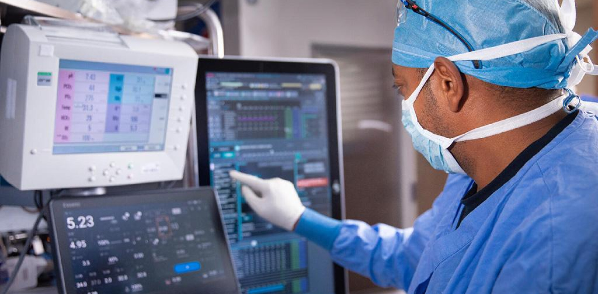A cardiovascular perfusionist inspecting the heart-lung machine