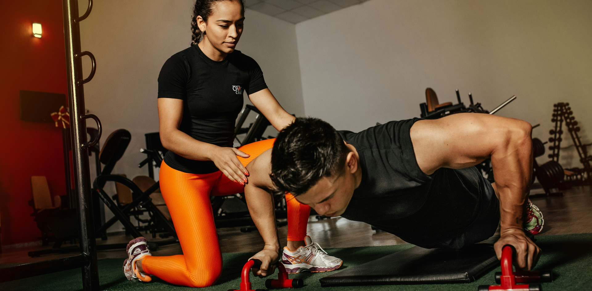 An athletic trainer working in the training room