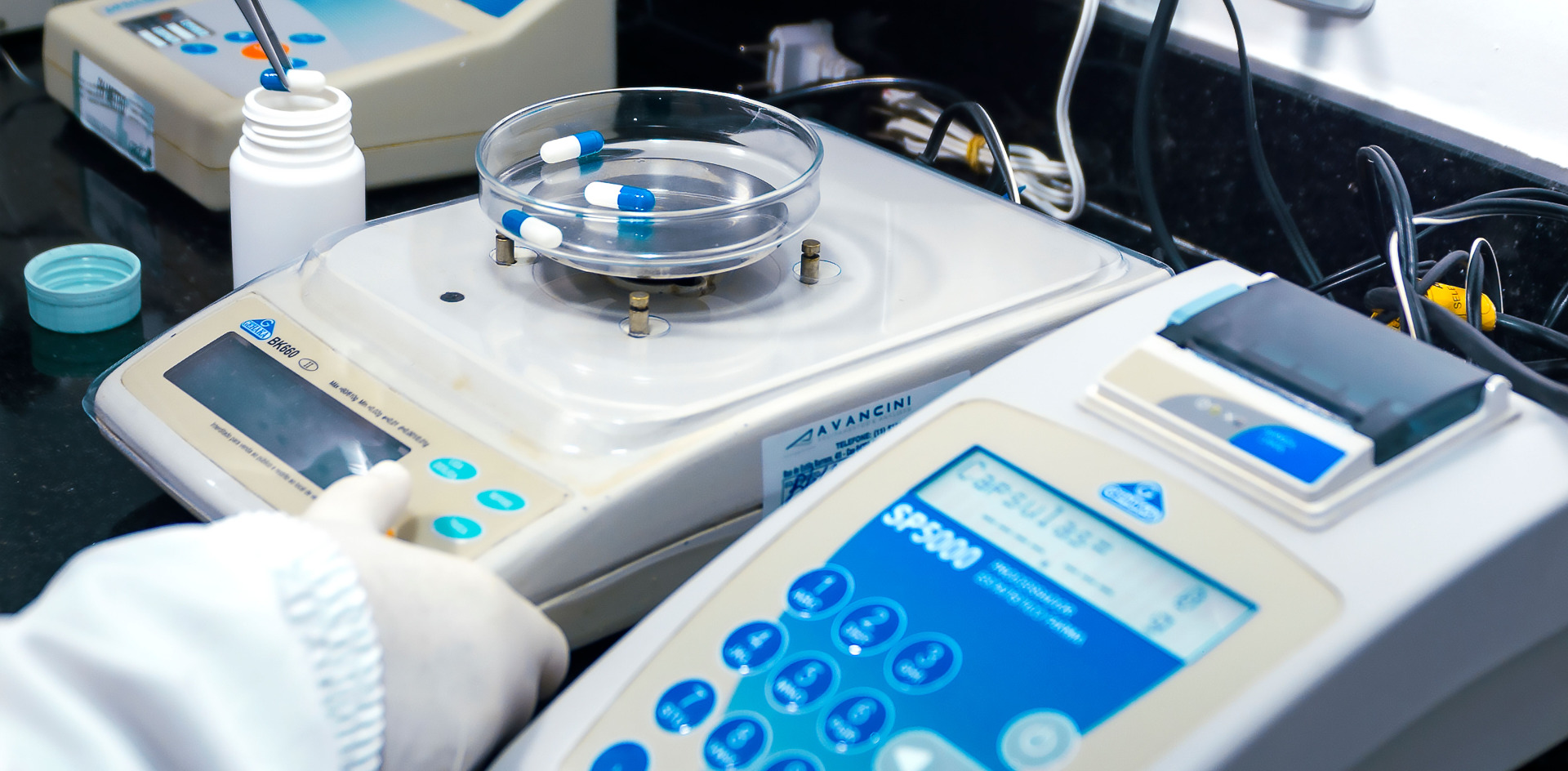 Laboratory equipment with capsules, capturing pharmaceutical analysis