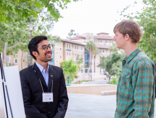 Image of students at poster session.