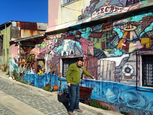 Student with wall of graffiti