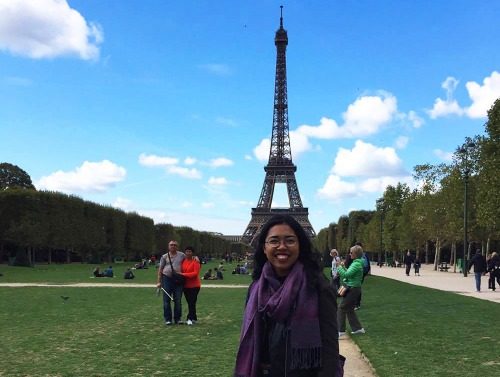 Student standing in front of Eiffel Tower