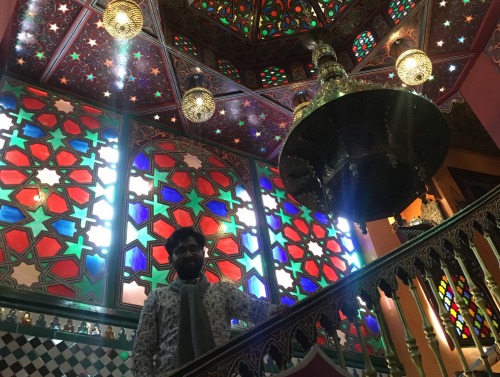 Student surrounded by stained glass