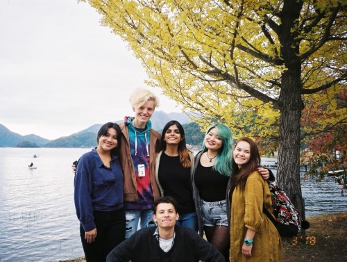 Group of students in front of water and mountains in Japan