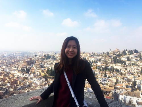 Student in front of cityscape in Granada