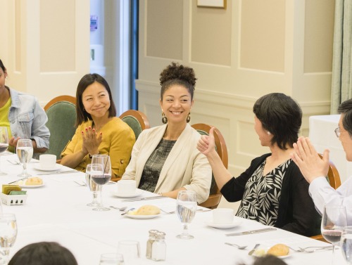 Sonya Douglass Horsford sitting at a table during a dinner party