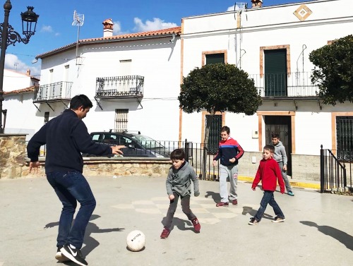 Image of children playing soccer in Seville, Spain.