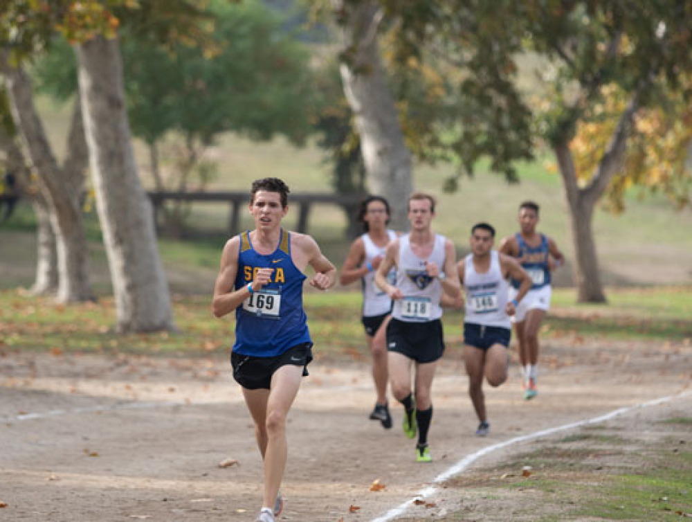 A Soka Cross Country team member is leading the pack in a race
