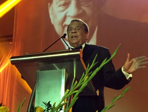 Andrew Young speaks at a podium