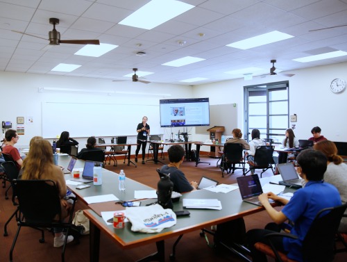 SIGS Summer Program participants sit in a classroom during a seminar