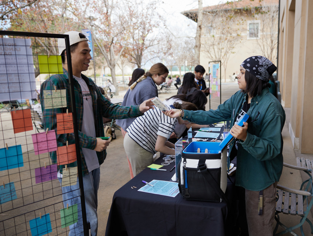 Students interact during a DEI event