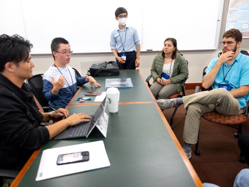 Students discuss during a simulation exercise