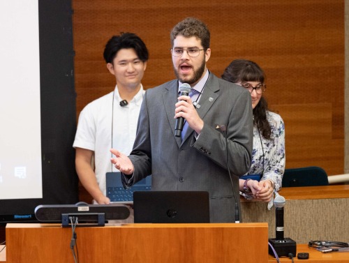 Presenters give their final project presentation during the Nuclear Politics Summer Program