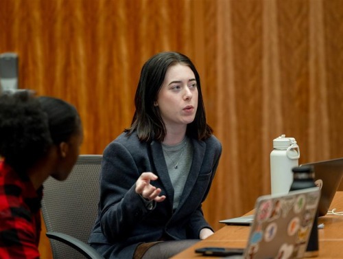 Carol Krein Robinson '25 speaks to fellow students during class at SUA.