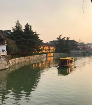 Buildings on either side of a river in Nanjing, China
