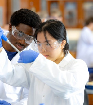 Two students working in a lab