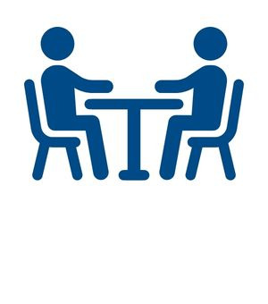 Two people sit at a table icon