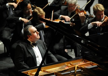 Yefim Bronfman sitting at piano at concert