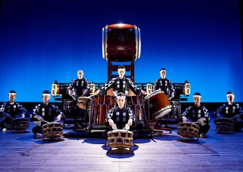 Group sitting on the floor drumming