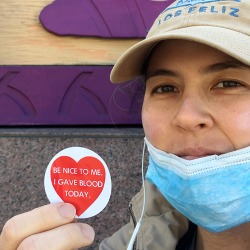 Victoria Kraus holding an "I gave blood today" sticker