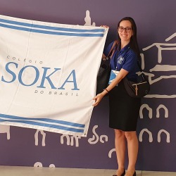 Maria Sanchez holds Soka flag