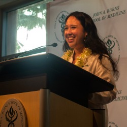 Erika Noel at a podium