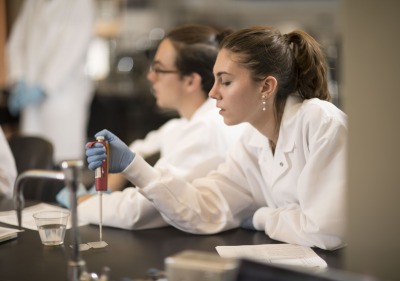 Image of a student working in a science lab.