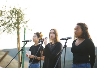 Image of students performing in garden