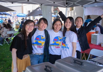 Image of festival volunteers smiling at the camera.
