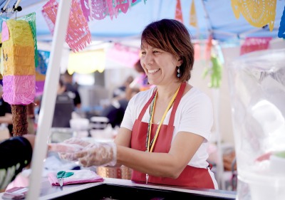 Image of woman serving at International Festival