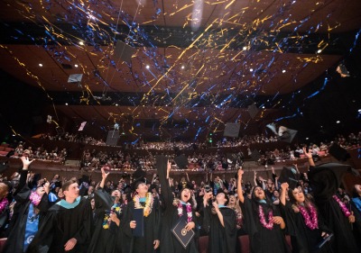 Photo of students with streamers at commencement ceremony