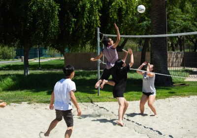 Image of students playing beach volleyball