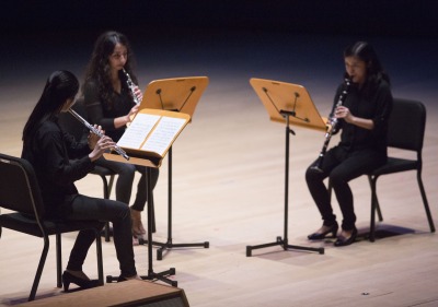 Image of a student musical trio performing in the Performing Arts Center.