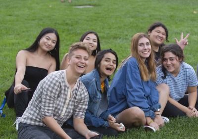 Image of students sitting on grass
