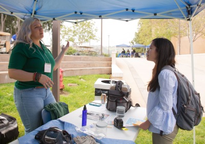 Image of a student speaking to employer at Career Fair.