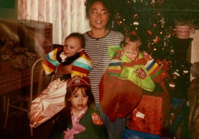 Image of a woman and three young children.