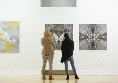 Soka University art gallery and people observing art
