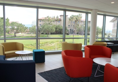 colorful chairs in the living room space of new residence hall