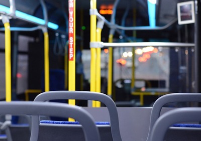 Interior of empty public bus at night