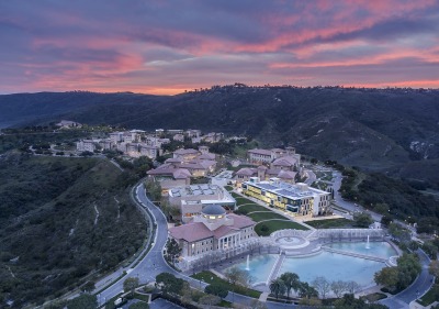 Aerial shot of campus during sunset with the sky burning pink and blue