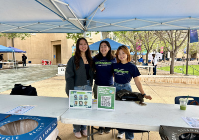 Photo of three Sustainability Educators at an event